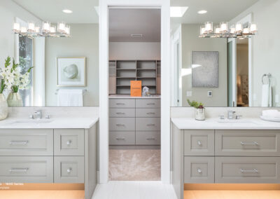 grey cabinets and white countertops in bathroom
