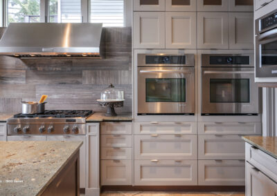 grey cabinets and marble countertops in kitchen